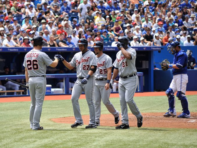 Detroit Tigers shortstop Jhonny Peralta (centre) celebrates his three-run home run with his teammates Brennan Boesch, Ryan Raburn and Delmon Young in the second inning. That was all the offence the Tigers would need as the visitors avoided a three-game sweep with a 4-1 win over the Toronto Blue Jays at Rogers Centre (John Lucero)